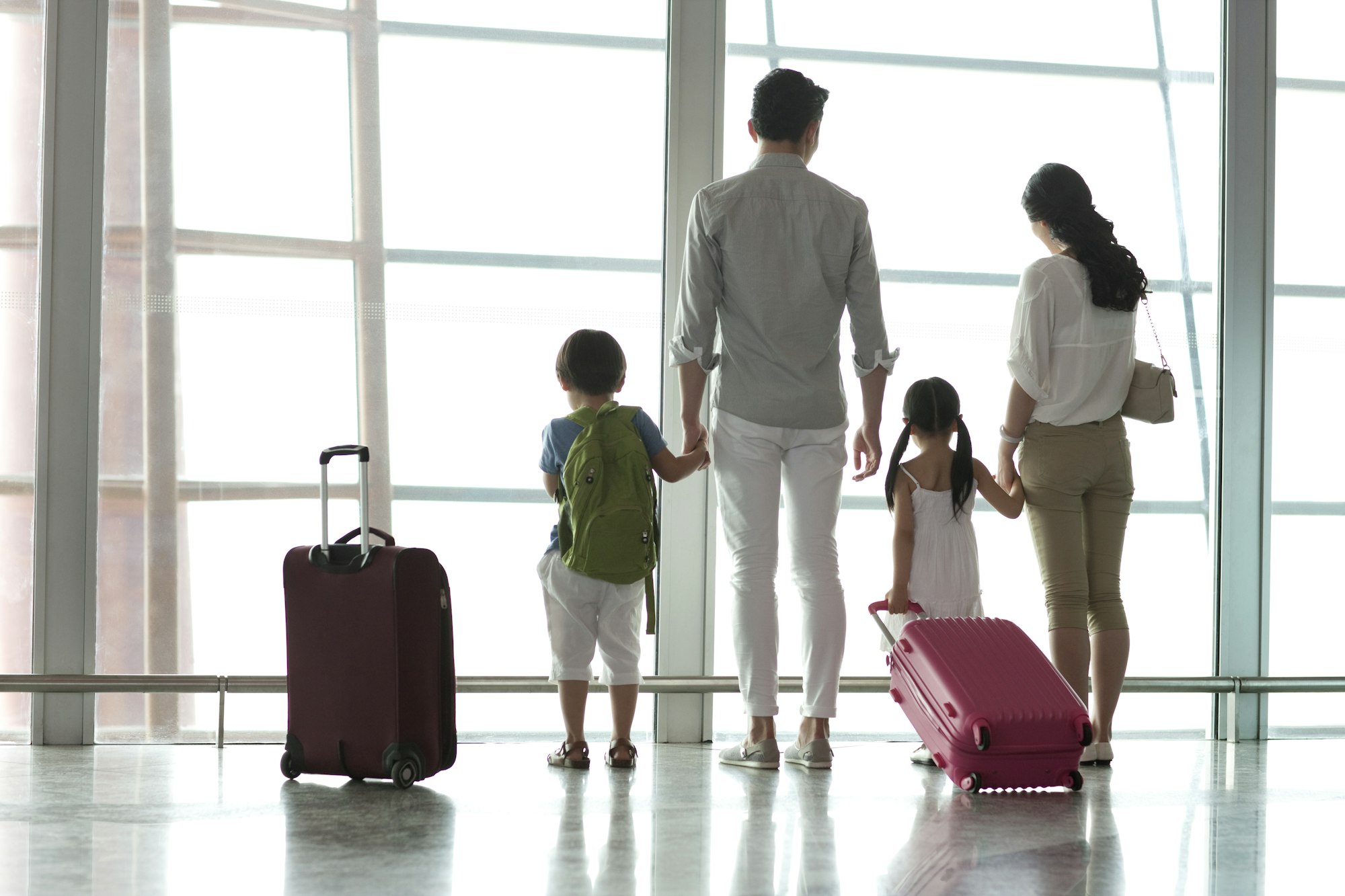 Young family looking at view at the airport
