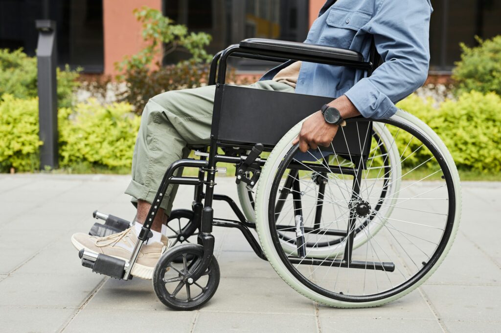 Unrecognizable invalid in wheelchair